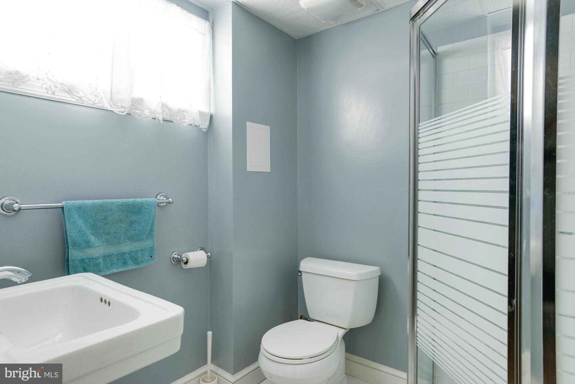 6224 30th Street Northwest Washington, DC 20015 - Photo 27 of 30 a white toilet sitting next to a bathtub