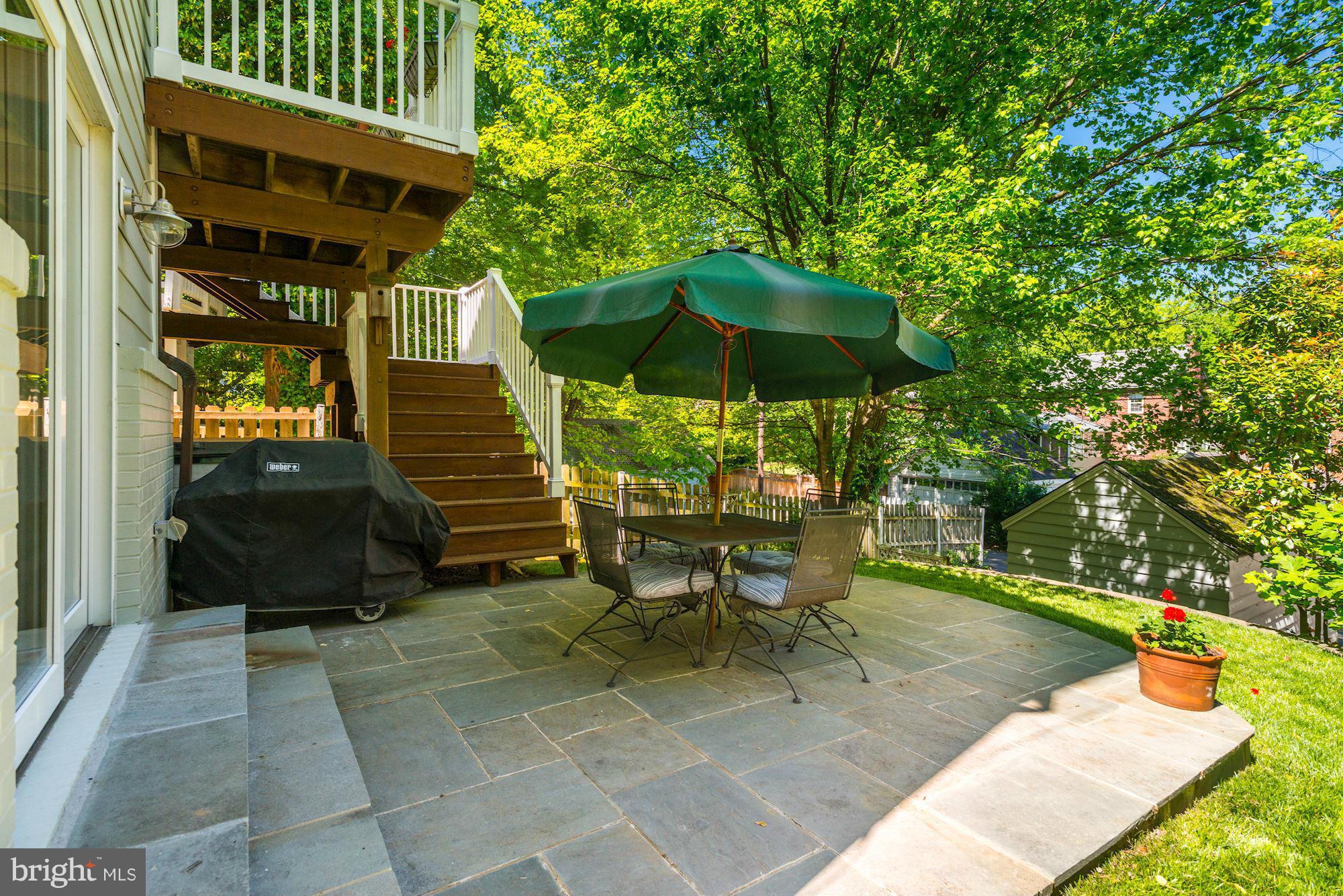 6224 30th Street Northwest Washington, DC 20015 - Photo 28 of 30 a view of a patio with table and chairs under an umbrella