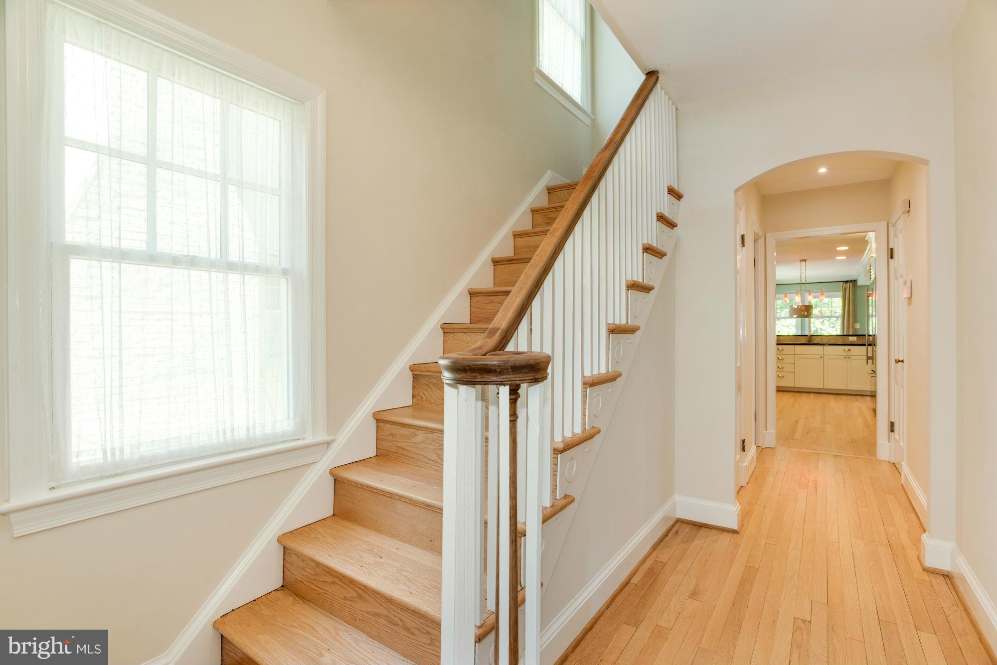 6224 30th Street Northwest Washington, DC 20015 - Photo 3 of 30 a view of a hallway with wooden floor and staircase