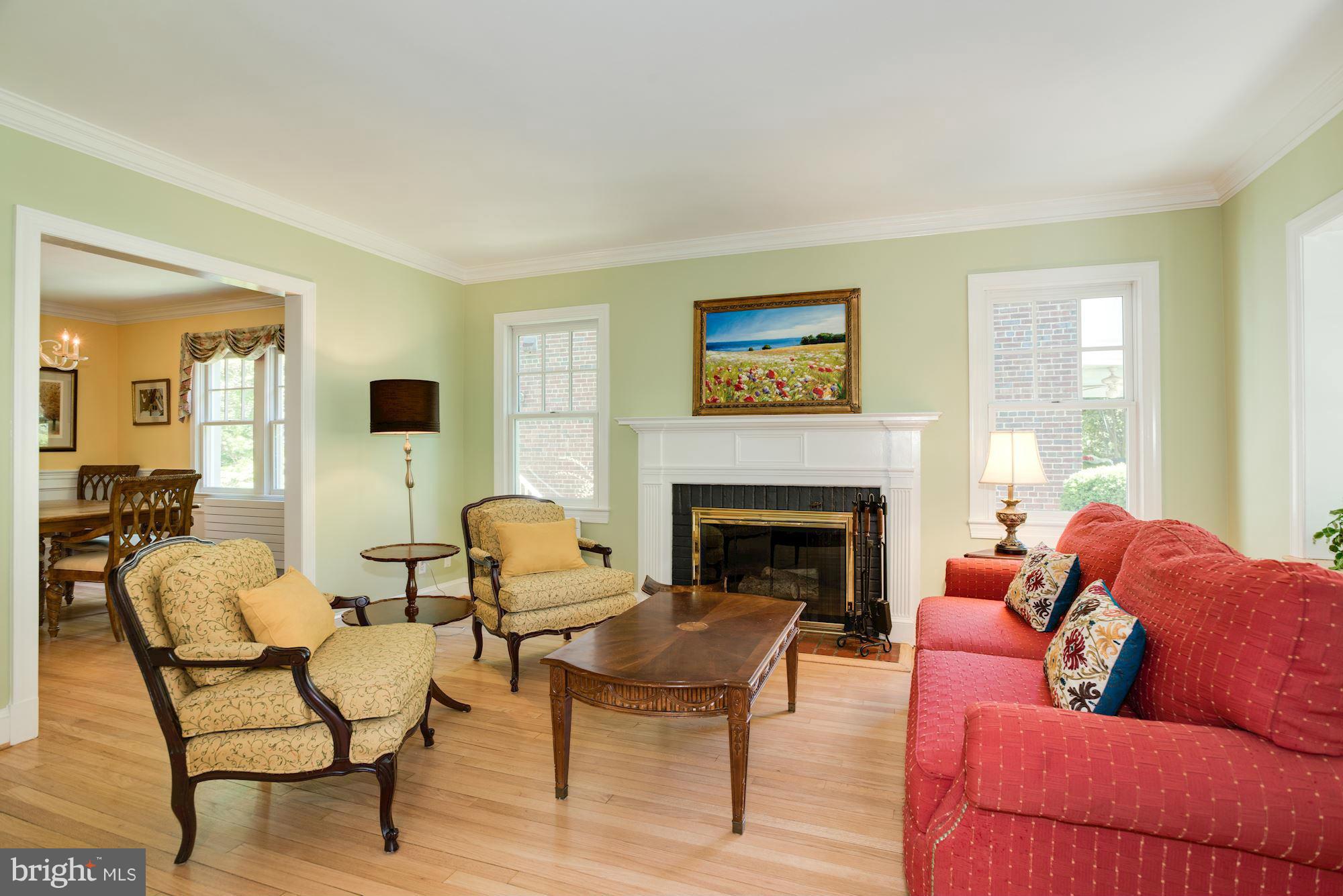 6224 30th Street Northwest Washington, DC 20015 - Photo 4 of 30 a living room with furniture and a fireplace