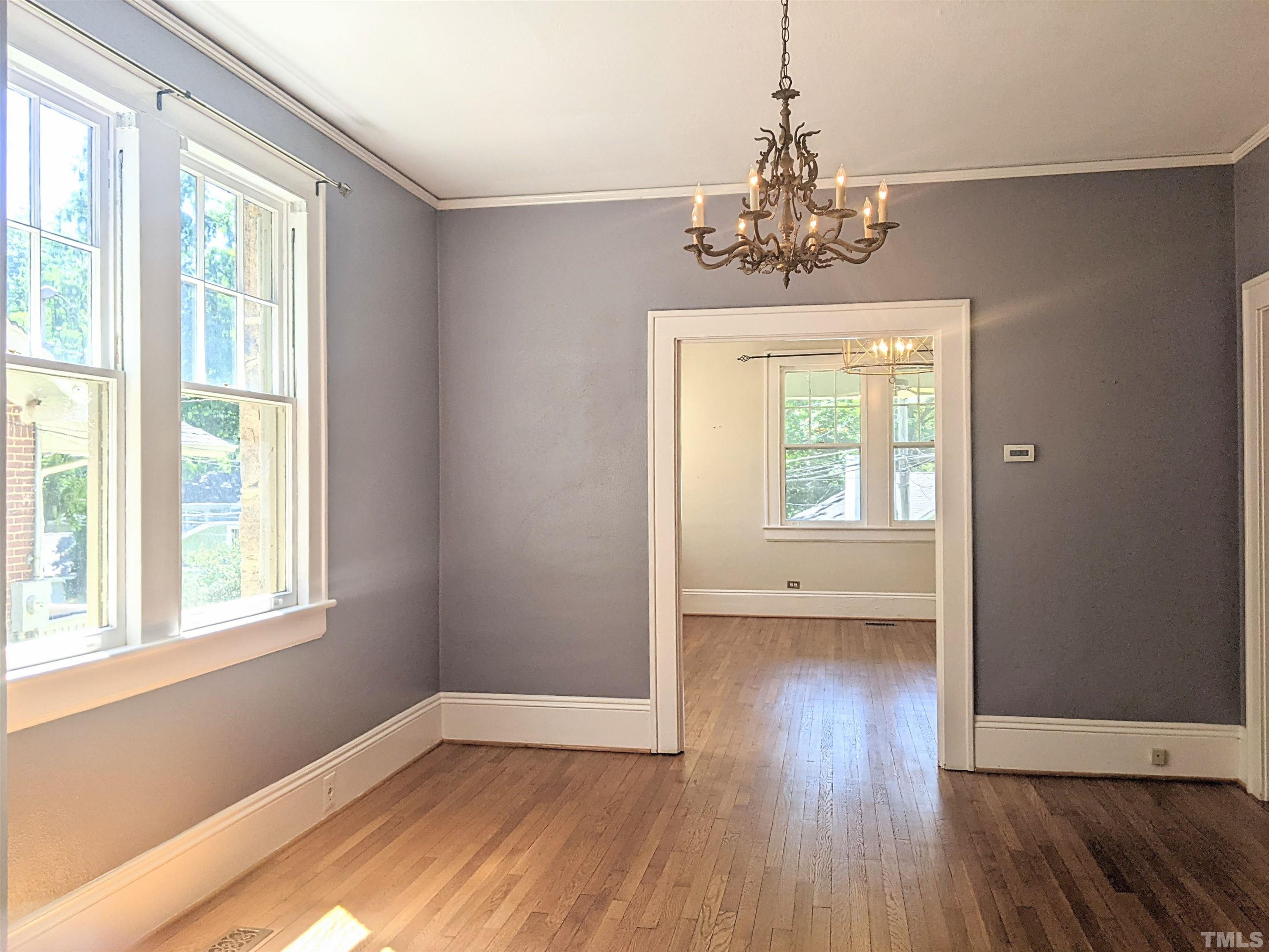 1925 Alexander Road Raleigh, NC 27608 - Photo 16 of 42 wooden floor in an empty room with a window