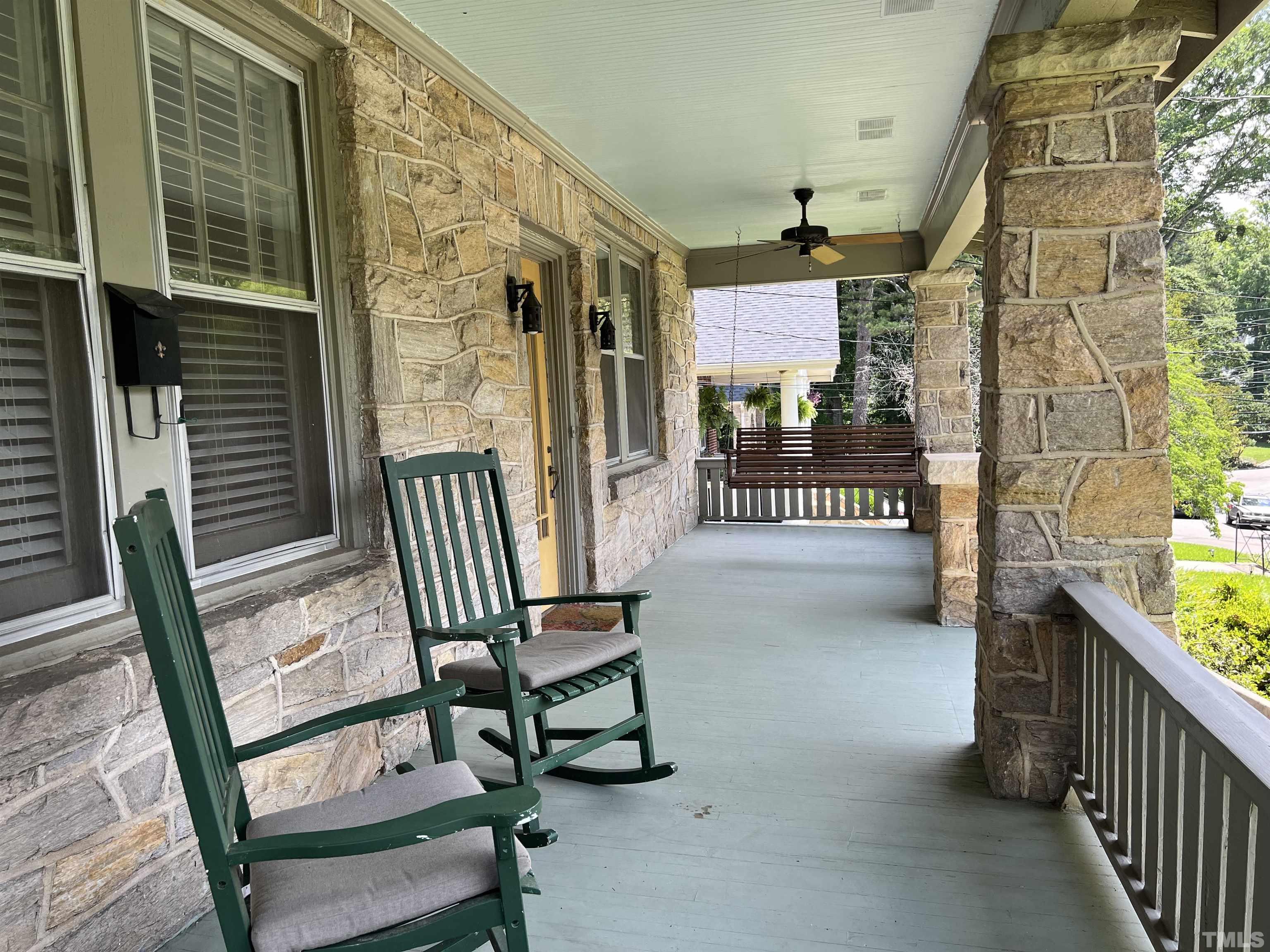 1925 Alexander Road Raleigh, NC 27608 - Photo 6 of 42 a view of a porch with furniture and a gate