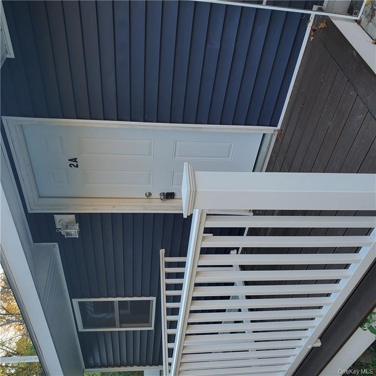 Doorway to property with a deck