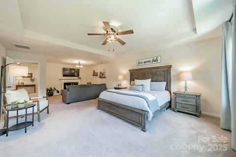 a bed room with furniture and a chandelier