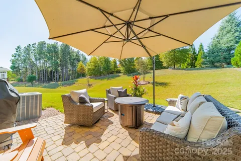 a view of a swimming pool with a lounge chairs