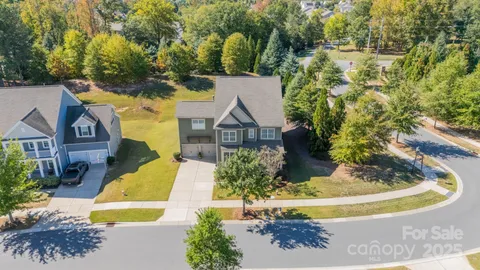 a view of a house with a yard and sitting area