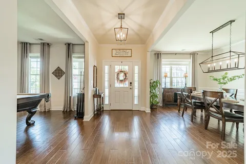 a view of a livingroom with furniture and hardwood floor