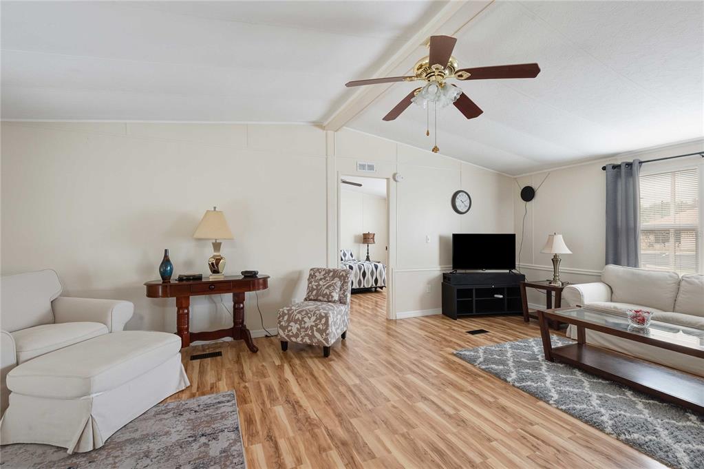 3125 Briar Street Wesley Chapel, FL 33543 - Photo 11 of 42 a living room with furniture and a flat screen tv