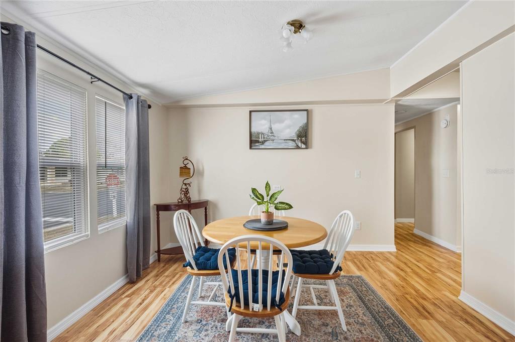 3125 Briar Street Wesley Chapel, FL 33543 - Photo 13 of 42 a view of a dining room with furniture window and wooden floor