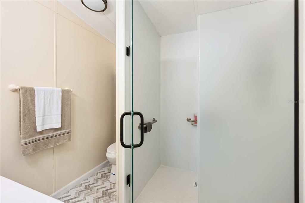 3125 Briar Street Wesley Chapel, FL 33543 - Photo 18 of 42 a bathroom with a shower