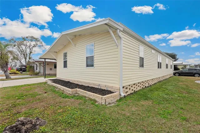 a view of a backyard with plants and a garden