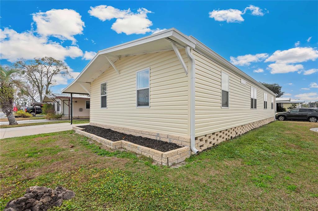 3125 Briar Street Wesley Chapel, FL 33543 - Photo 2 of 42 a view of a backyard with plants and a garden