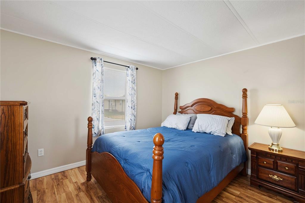 3125 Briar Street Wesley Chapel, FL 33543 - Photo 21 of 42 a bedroom with bed and a night stand