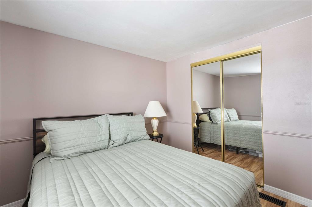 3125 Briar Street Wesley Chapel, FL 33543 - Photo 24 of 42 a bedroom with a bed and a mirror