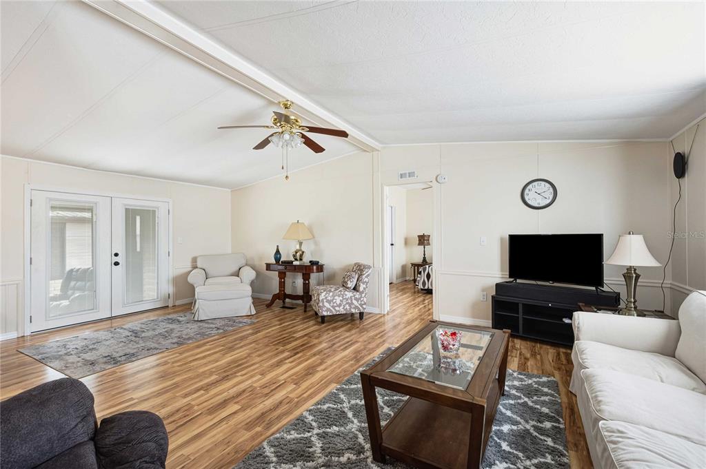3125 Briar Street Wesley Chapel, FL 33543 - Photo 8 of 42 a living room with furniture and a flat screen tv
