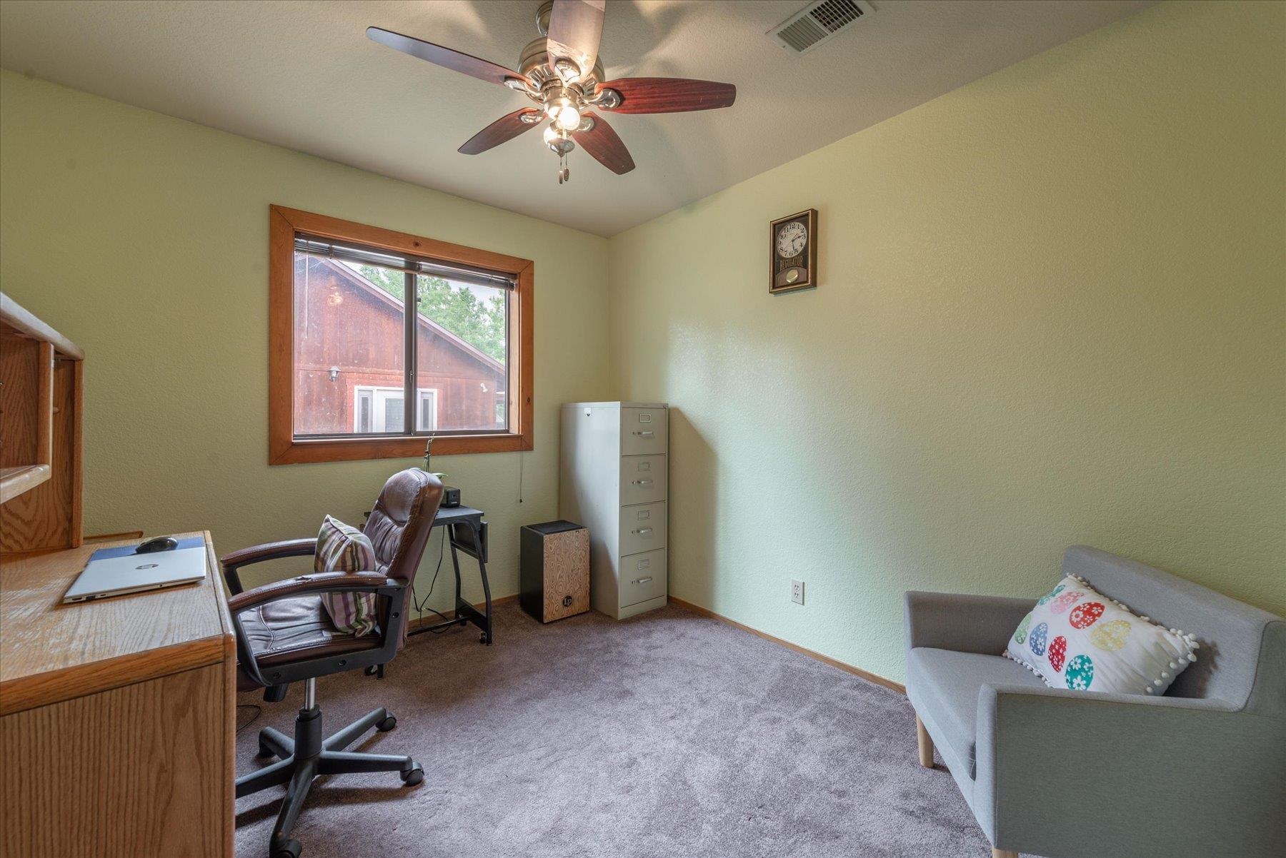 16006 Rolands Way Truckee, CA 96161 - Photo 11 of 19 a view of a workspace with furniture and a window