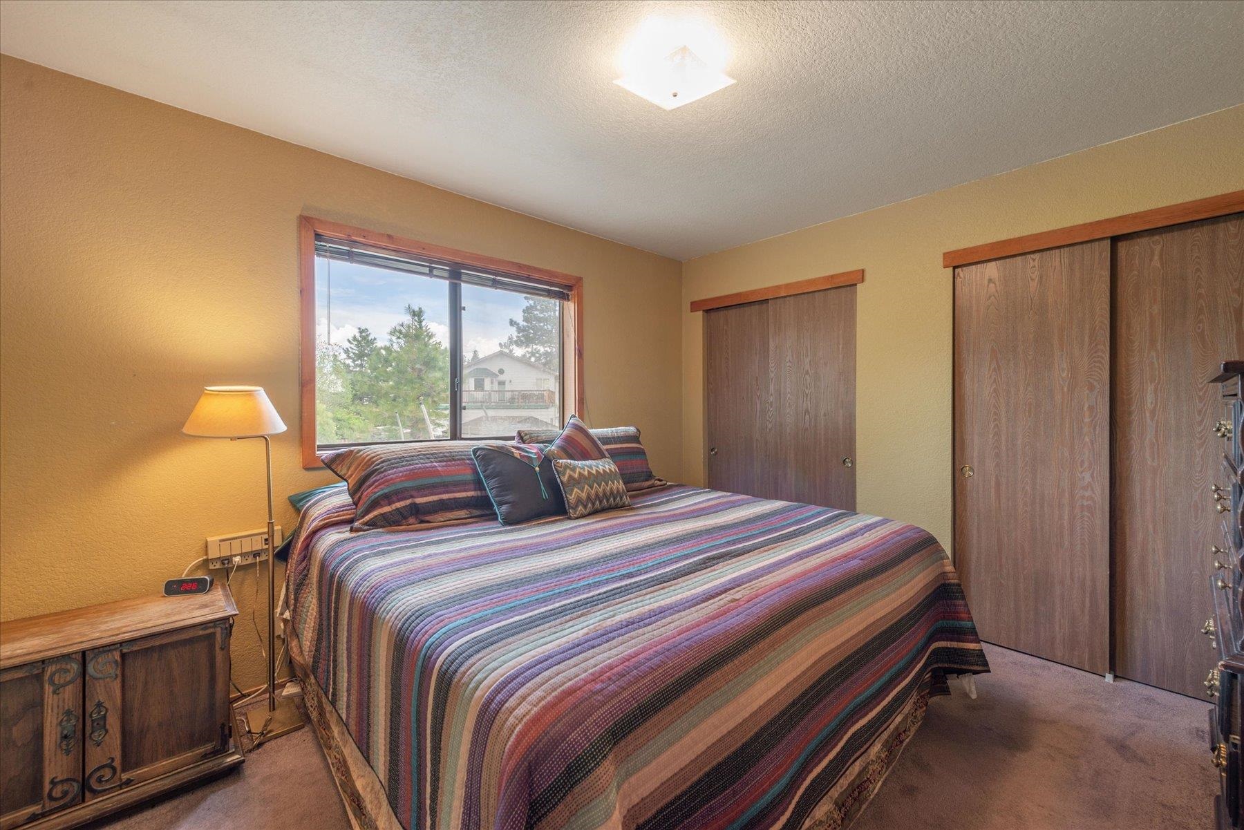 16006 Rolands Way Truckee, CA 96161 - Photo 14 of 19 a bedroom with a bed and a large window