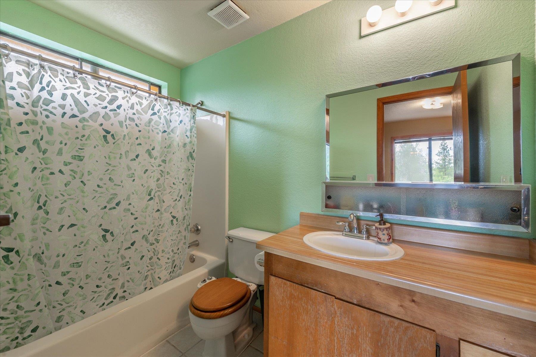 16006 Rolands Way Truckee, CA 96161 - Photo 16 of 19 a bathroom with a sink toilet and shower