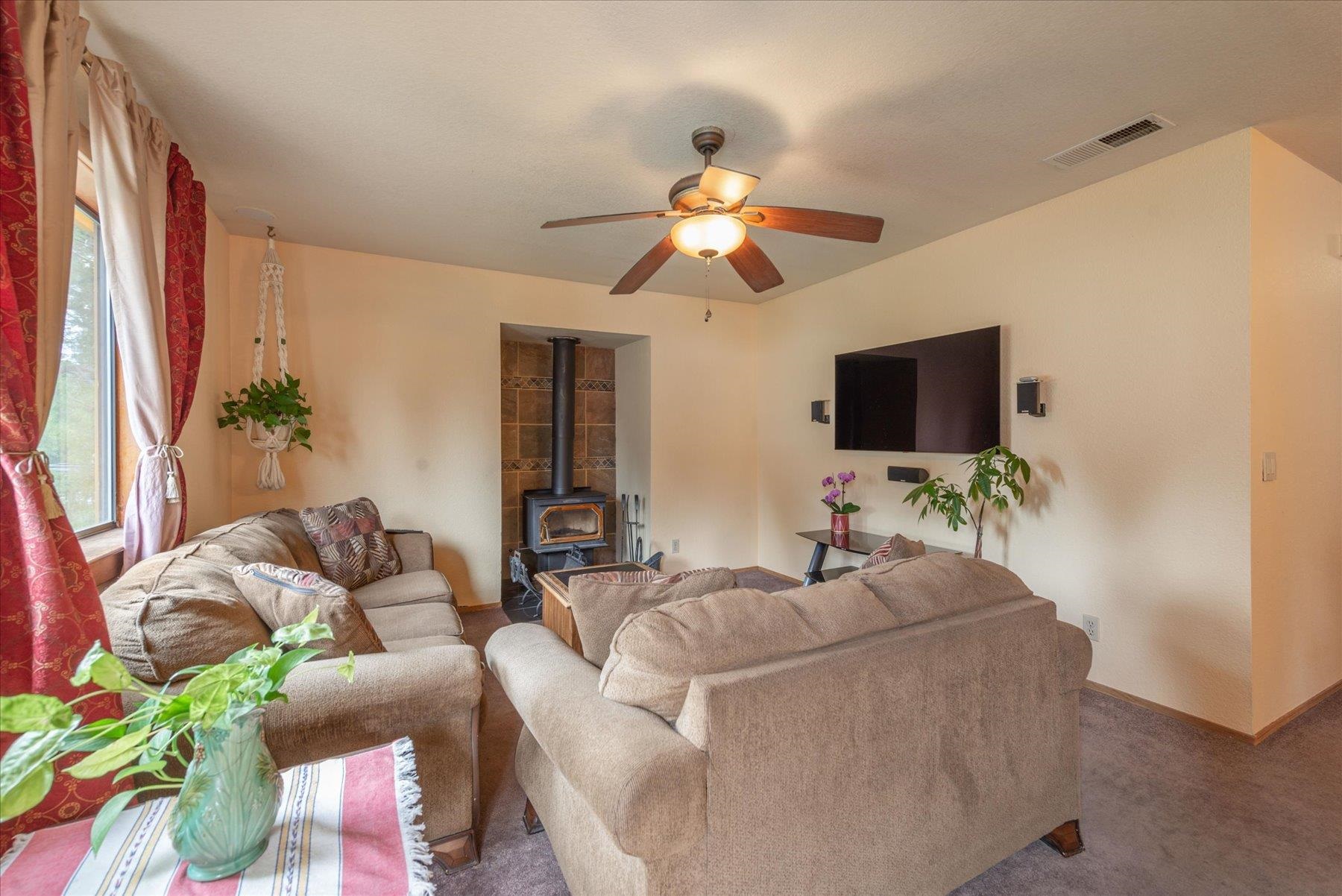 16006 Rolands Way Truckee, CA 96161 - Photo 3 of 19 a living room with furniture and a flat screen tv