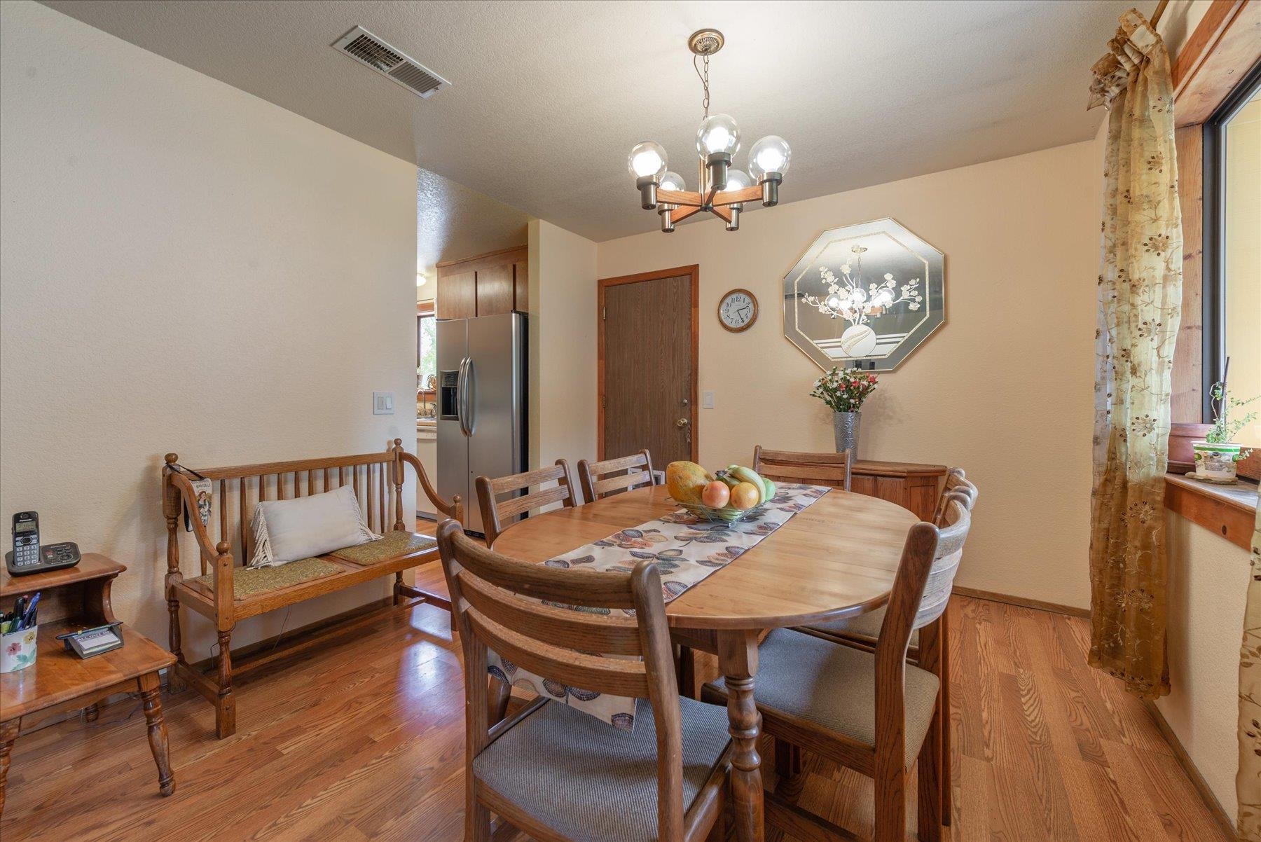 16006 Rolands Way Truckee, CA 96161 - Photo 6 of 19 a view of a dining room with furniture wooden floor and chandelier