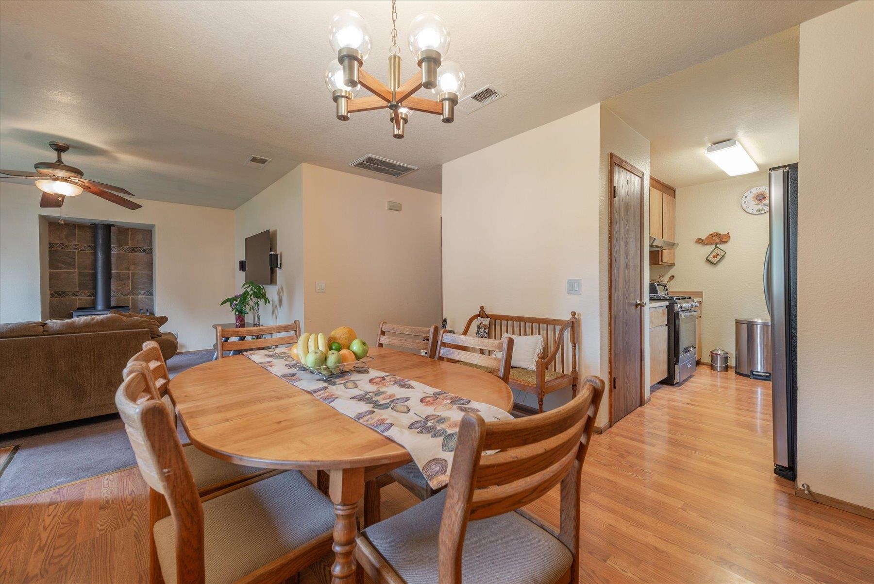 16006 Rolands Way Truckee, CA 96161 - Photo 7 of 19 a view of a dining room with furniture and wooden floor