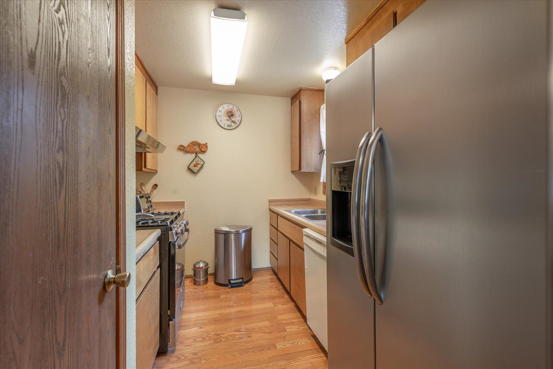 16006 Rolands Way Truckee, CA 96161 - Photo 8 of 19 a kitchen with cabinets and stainless steel appliances