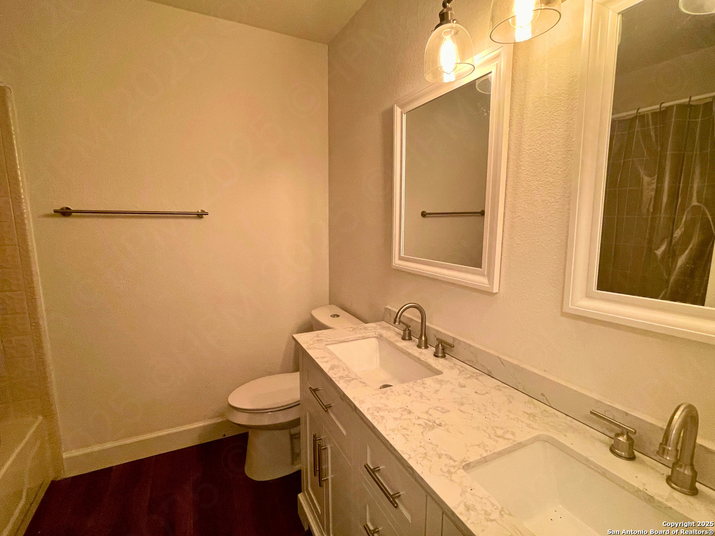 7727 Broken Arrow Converse, TX 78109 - Photo 12 of 17 a bathroom with a granite countertop sink toilet and a mirror