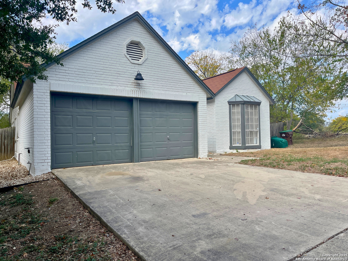 7727 Broken Arrow Converse, TX 78109 - Photo 3 of 17 a front view of a house with a yard and garage