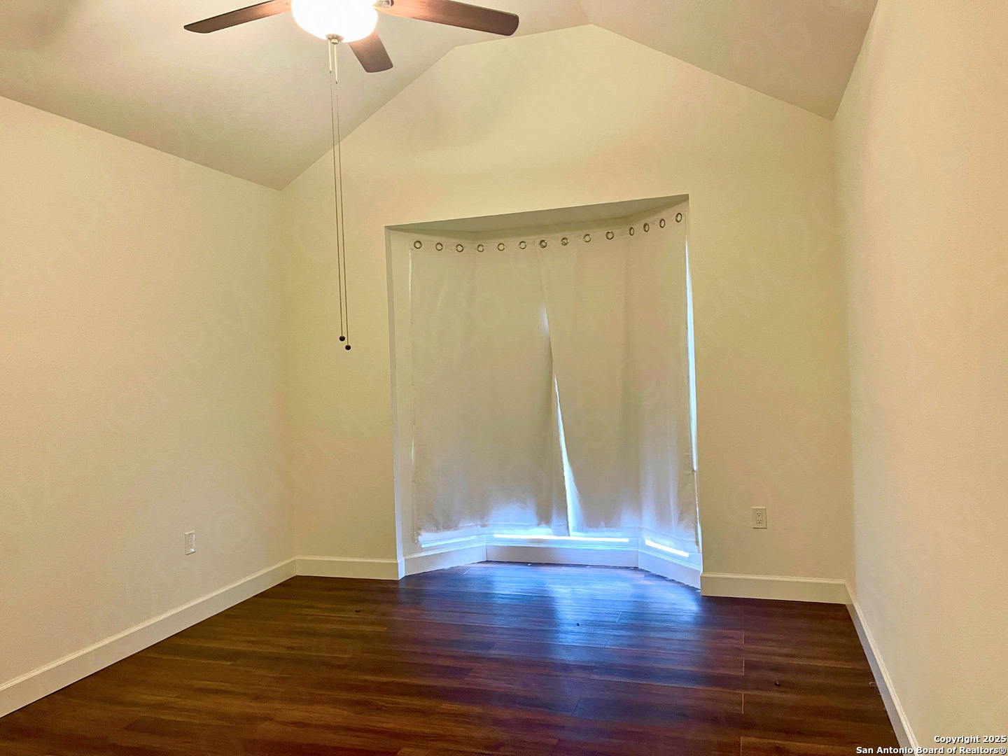 7727 Broken Arrow Converse, TX 78109 - Photo 8 of 17 a view of an empty room with wooden floor