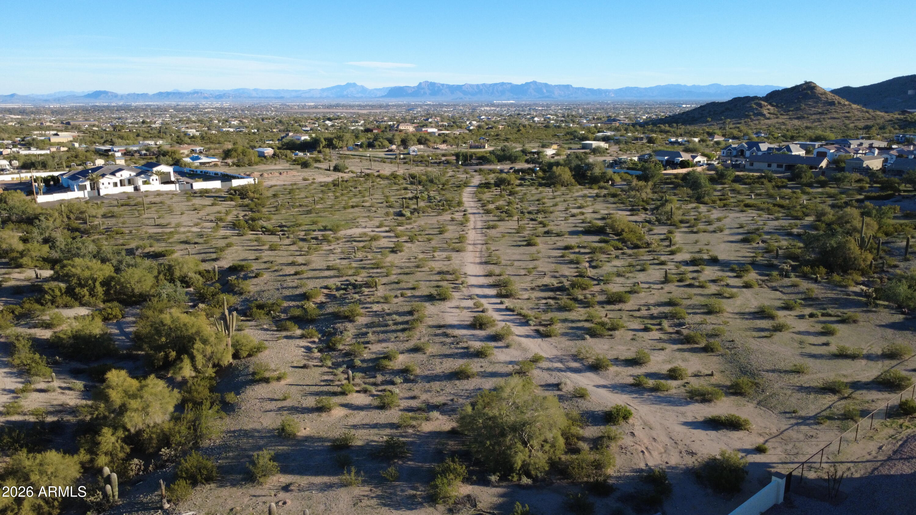 0 North Bell Road, Unit 348 Queen Creek, AZ 85144 - Photo 7 of 8 an aerial view of residential houses with outdoor space and trees