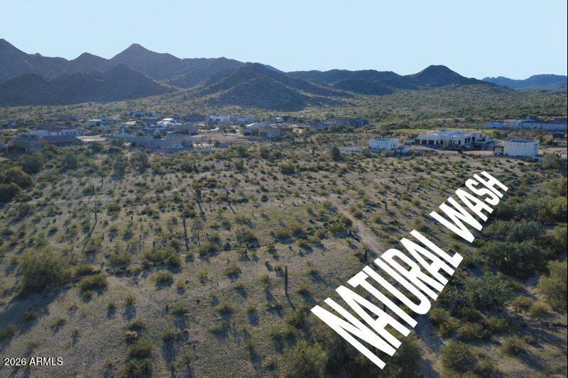 0 North Bell Road, Unit 348 Queen Creek, AZ 85144 - Photo 8 of 8 a view of a lush green hillside and a building