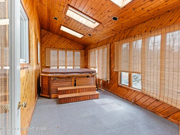 a room with stairs and a chandelier