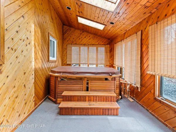 a view of an entryway with wooden floor