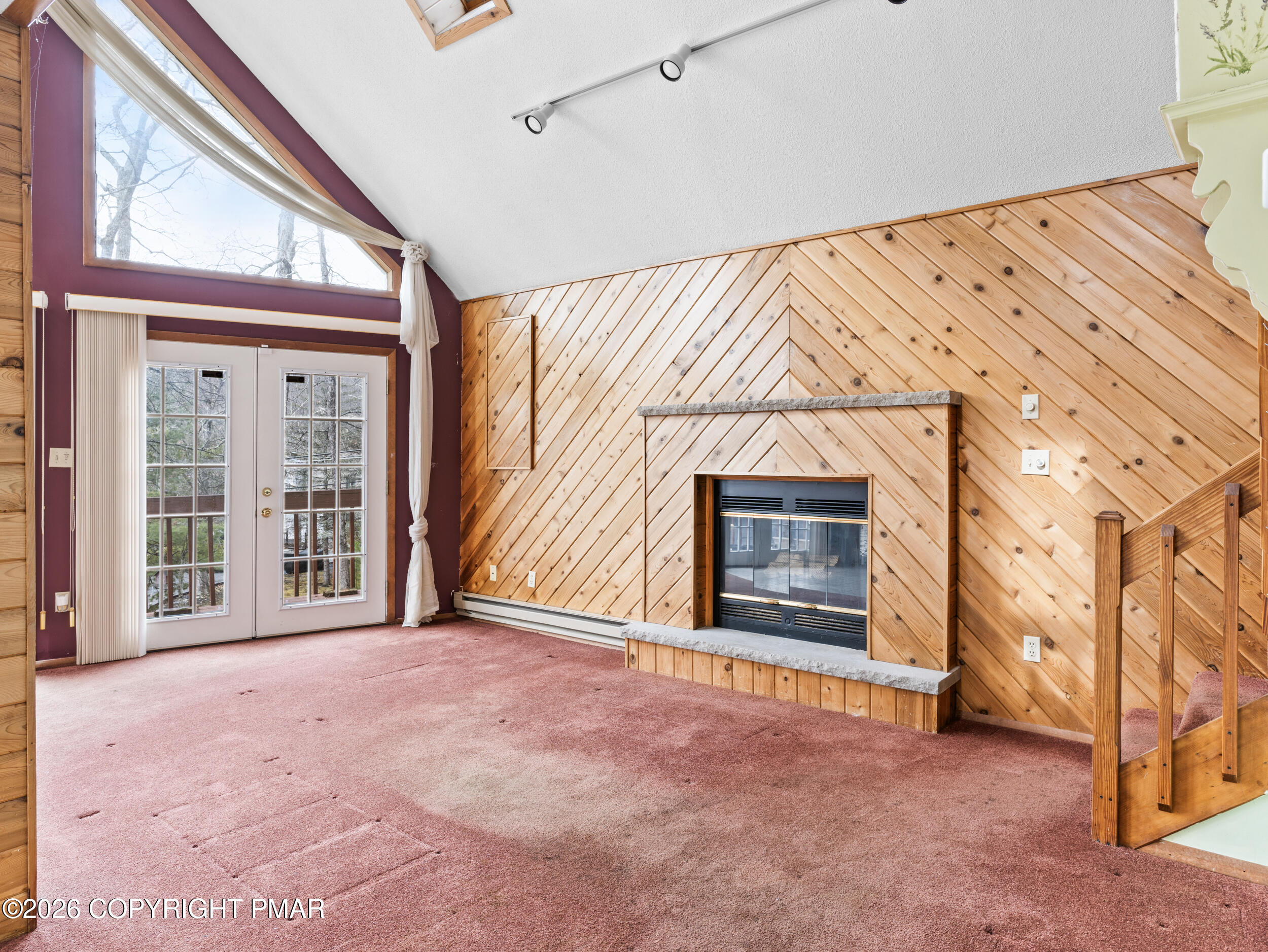 270 Manchester Drive Bushkill, PA 18324 - Photo 23 of 58 a view of an empty room with a fireplace and a window
