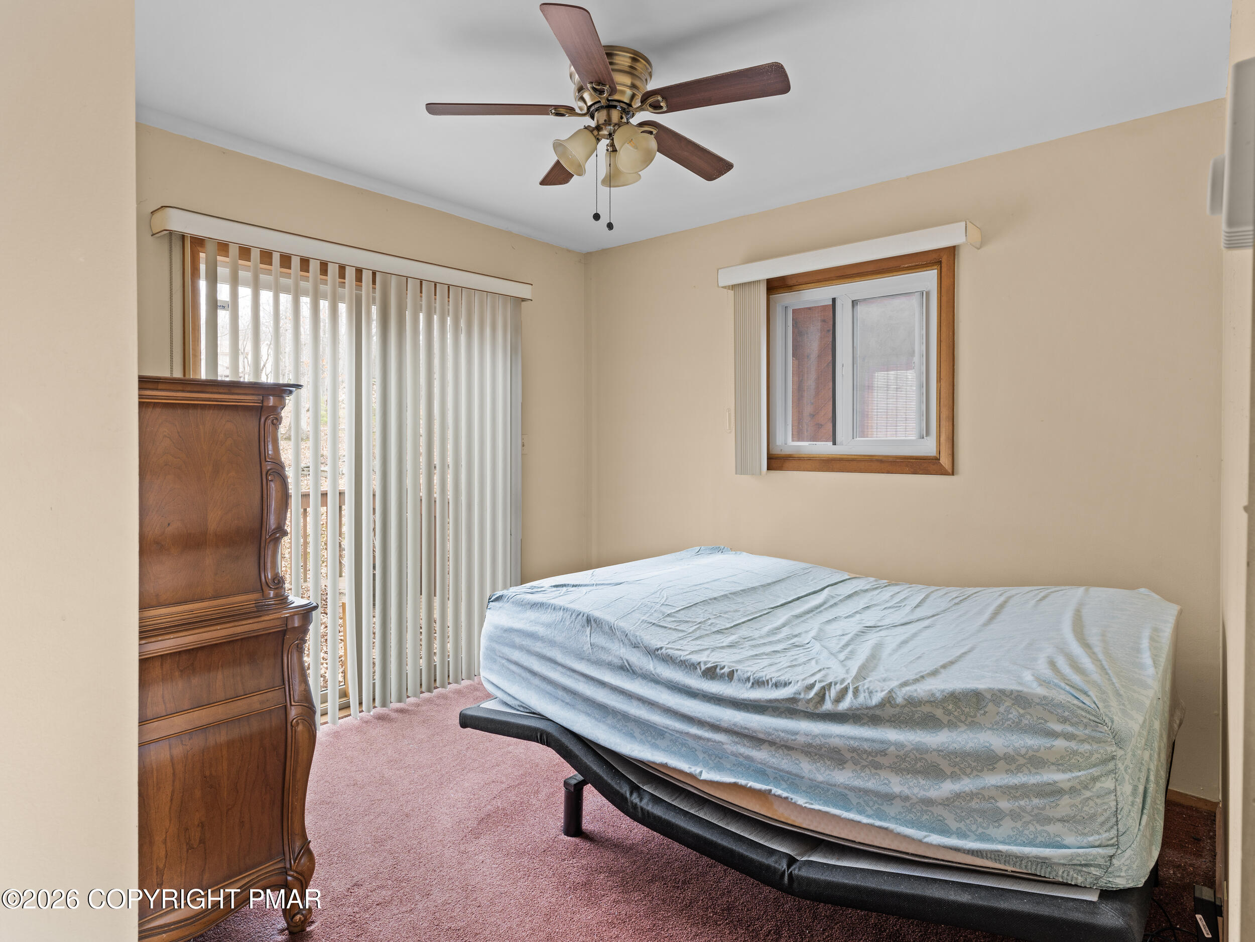 270 Manchester Drive Bushkill, PA 18324 - Photo 24 of 58 a bedroom with a bed and a chandelier