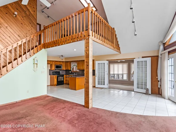 a view of entryway livingroom and hall