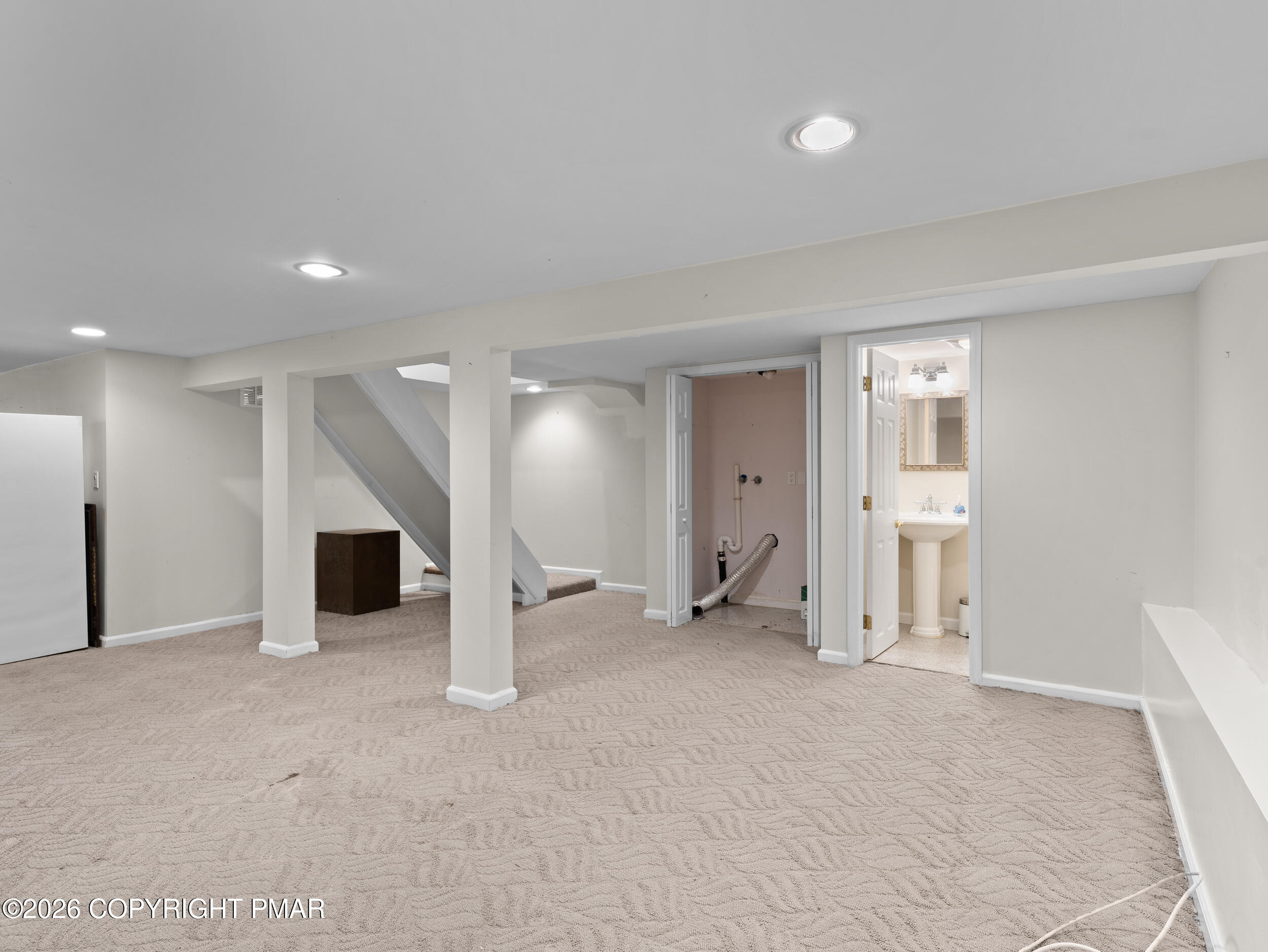 270 Manchester Drive Bushkill, PA 18324 - Photo 40 of 58 an empty room with a cabinet and mirrors