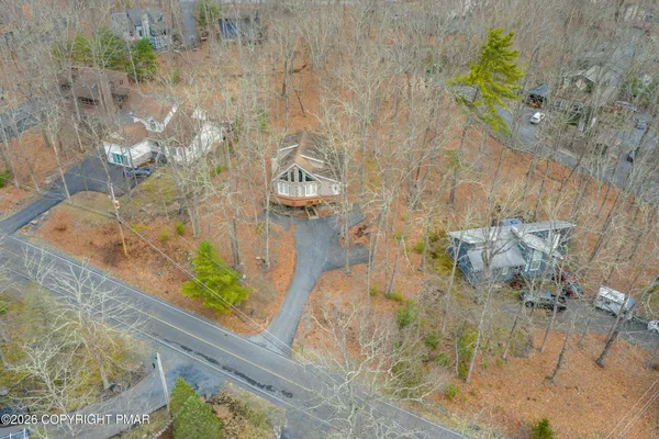 an aerial view of a house with outdoor space