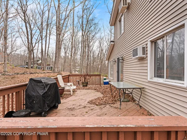 a view of a backyard with table and chairs
