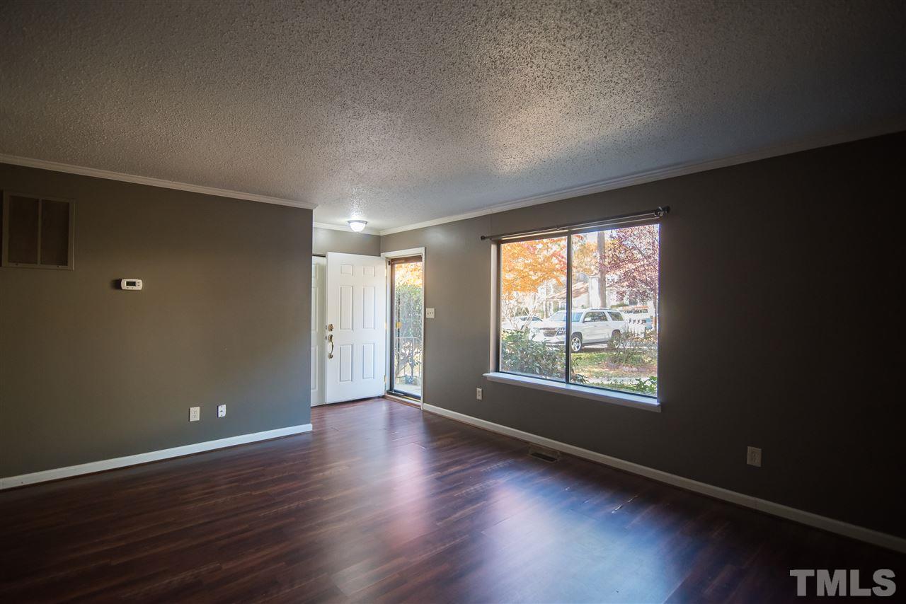 816 Green Ridge Drive Raleigh, NC 27609 - Photo 2 of 14 Be greeted by your large living room. The coat closet and extra storage closet are every organizer's dream!