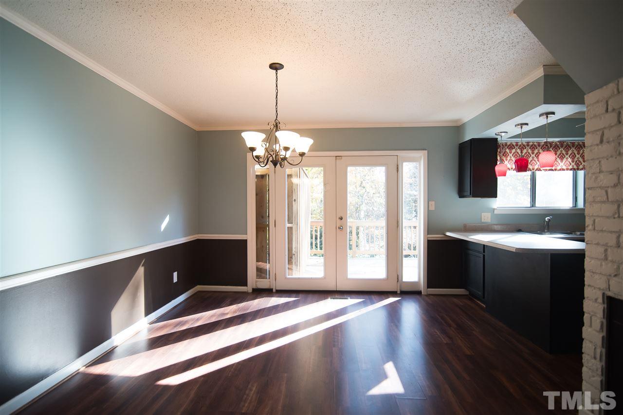 816 Green Ridge Drive Raleigh, NC 27609 - Photo 5 of 14 French doors open to your back deck and your counter top bar is ideal!