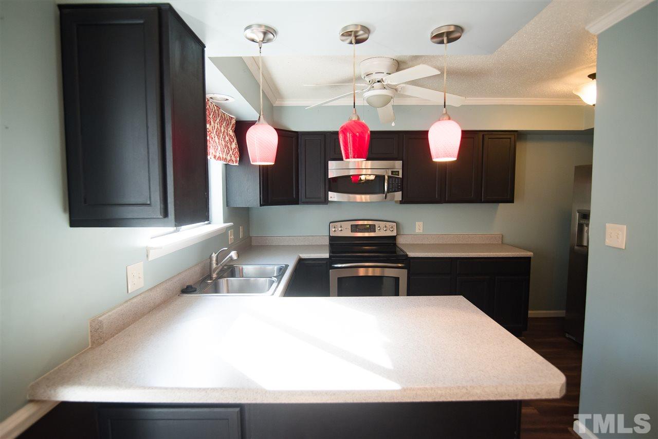 816 Green Ridge Drive Raleigh, NC 27609 - Photo 8 of 14 Cooking will be a delight your kitchen which offers stainless steel GE Profile appliances and counter space for all of your cooking needs!