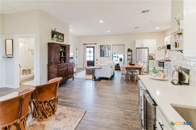 a living room with fireplace furniture and a flat screen tv