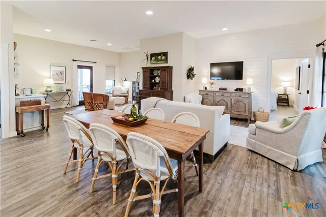 a living room with fireplace furniture and a flat screen tv