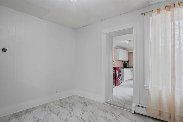 a view of a room with wooden floor and closet