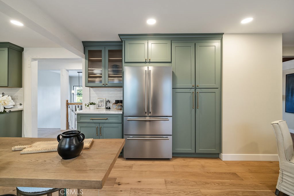 275 Fairview Road Ojai, CA 93023 - Photo 11 of 74 a kitchen with granite countertop a refrigerator and a sink