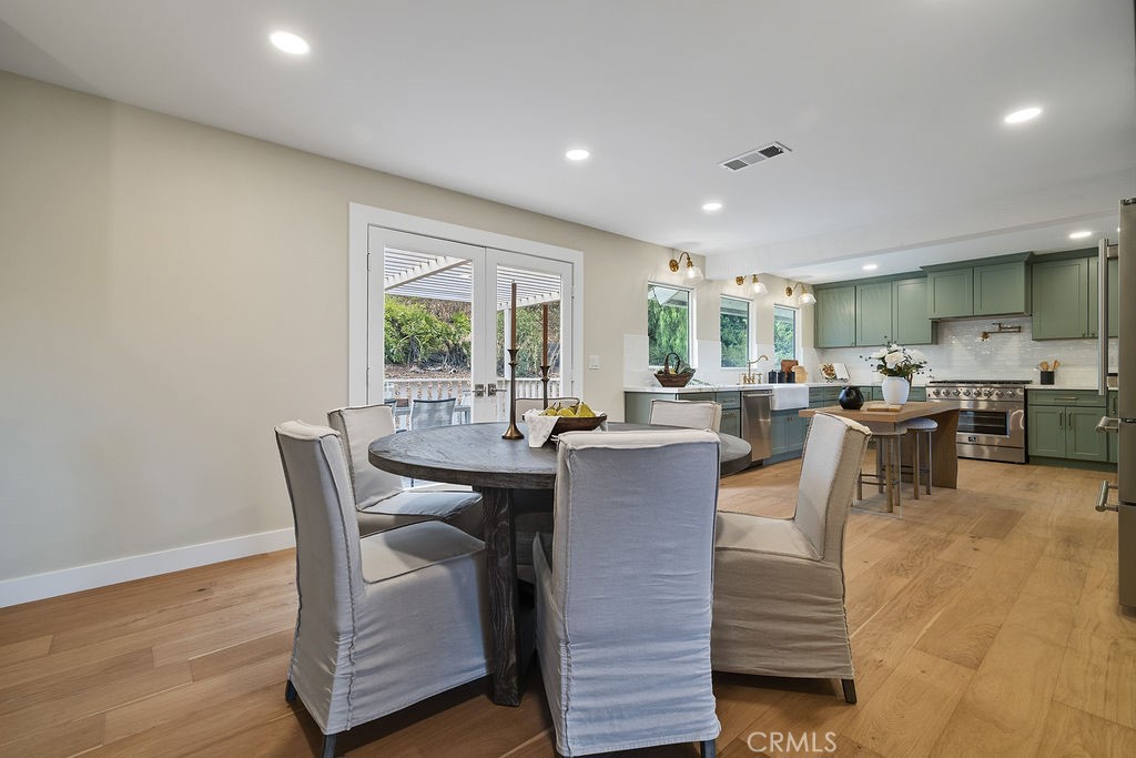 275 Fairview Road Ojai, CA 93023 - Photo 14 of 74 a view of a dining room with furniture window and wooden floor