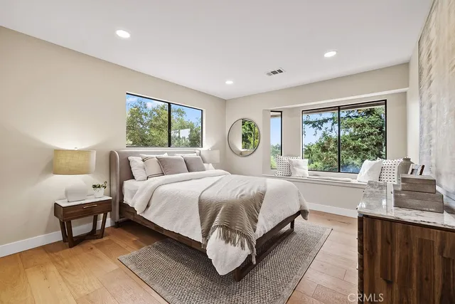 a bathroom with a double vanity sink a mirror and a