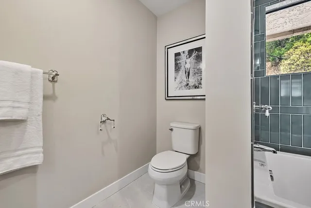 a view of a two chairs and table in the balcony