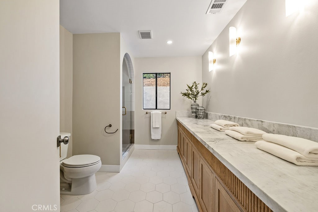 275 Fairview Road Ojai, CA 93023 - Photo 42 of 74 a bathroom with a granite countertop sink a toilet and shower